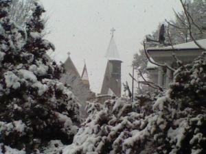 From our front porch we can glimpse a view of one of the two churches on the street corner.  I like to look at the churches and homes on our street and wonder what life was like when they were built (around 1900).