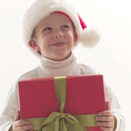 Young Boy Holding Christmas Gift