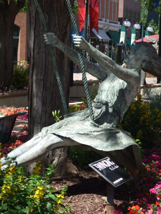 Swinging, by artist Lee Stark, brings a sense of motion to a quite stationary piece. Fort Collins, Colorado.